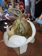 T-Rex baby dinosaur hatching from egg 
